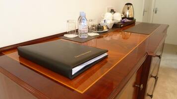 Premium bedding, desk, laptop workspace, iron/ironing board