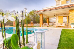 Seasonal outdoor pool, pool loungers
