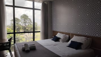 Habitación de lujo | Sábanas de algodón egipcio, ropa de cama de alta calidad y minibar