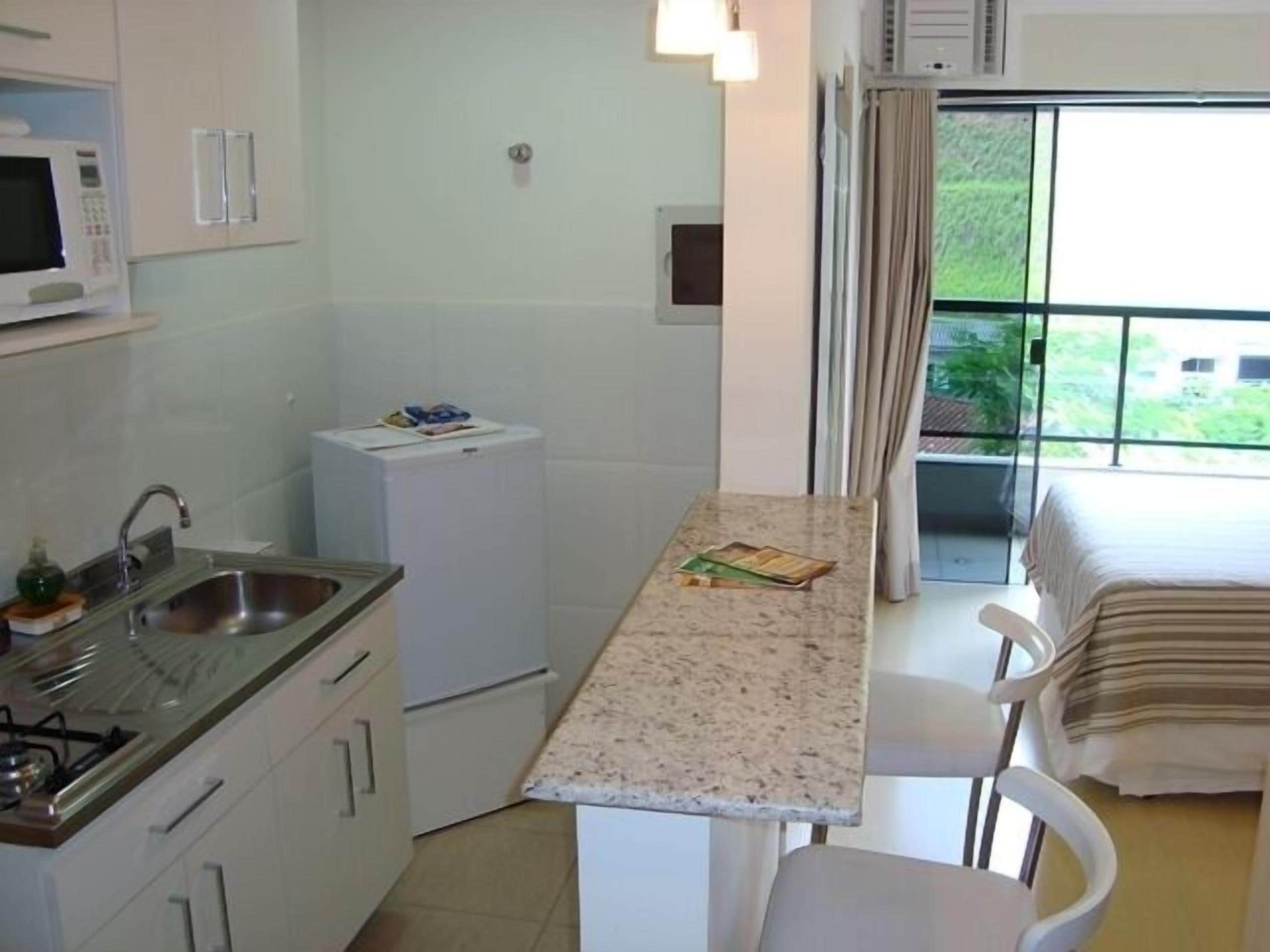 deluxe room | private kitchen | microwave, stovetop, high chair, cookware/dishes/utensils