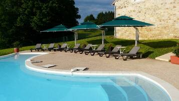 Indoor pool, outdoor pool, pool umbrellas, pool loungers