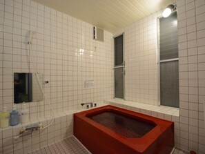 Separate tub and shower, free toiletries, hair dryer, slippers