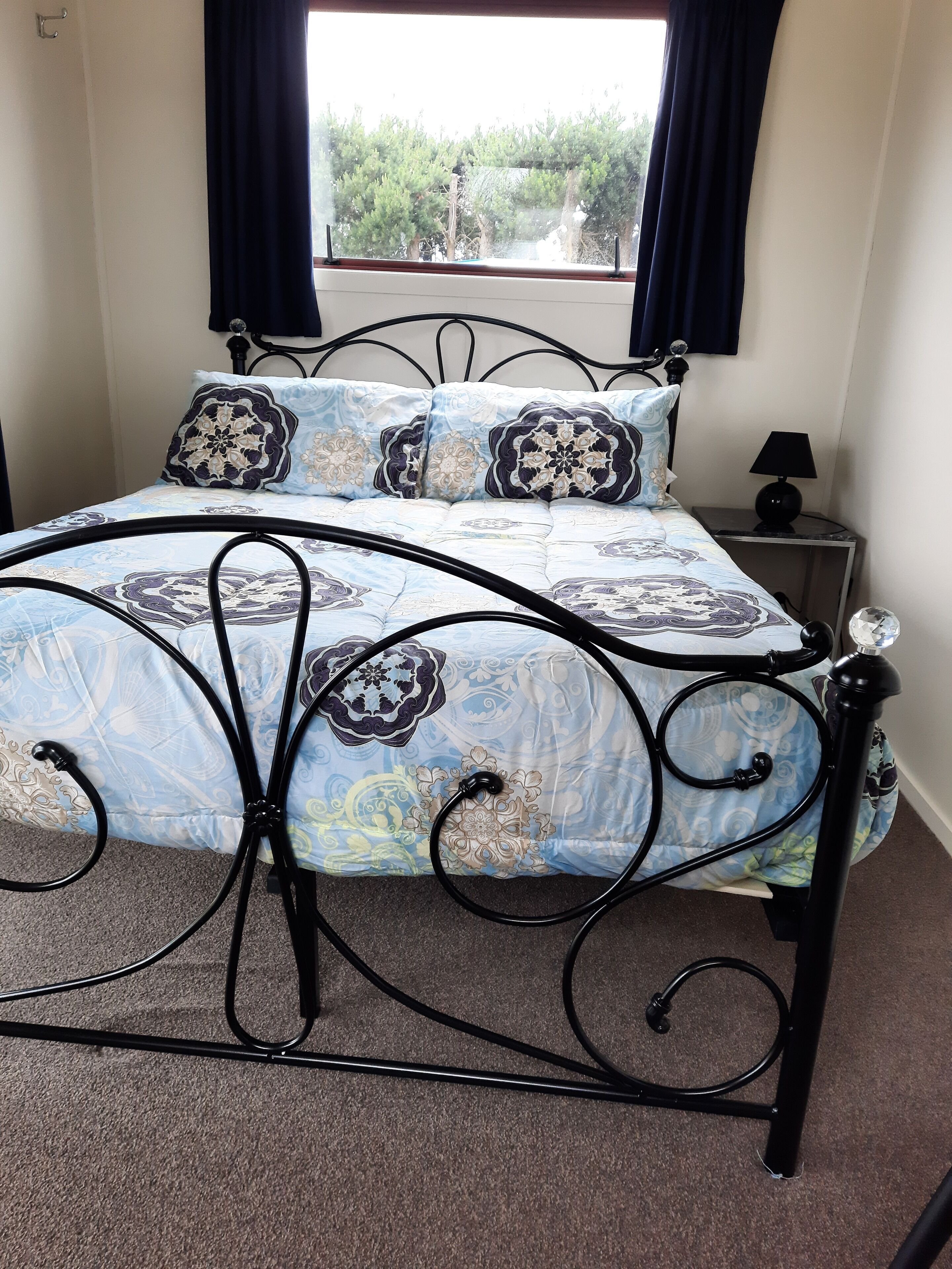 Premium bedding, blackout drapes, iron/ironing board, bed sheets