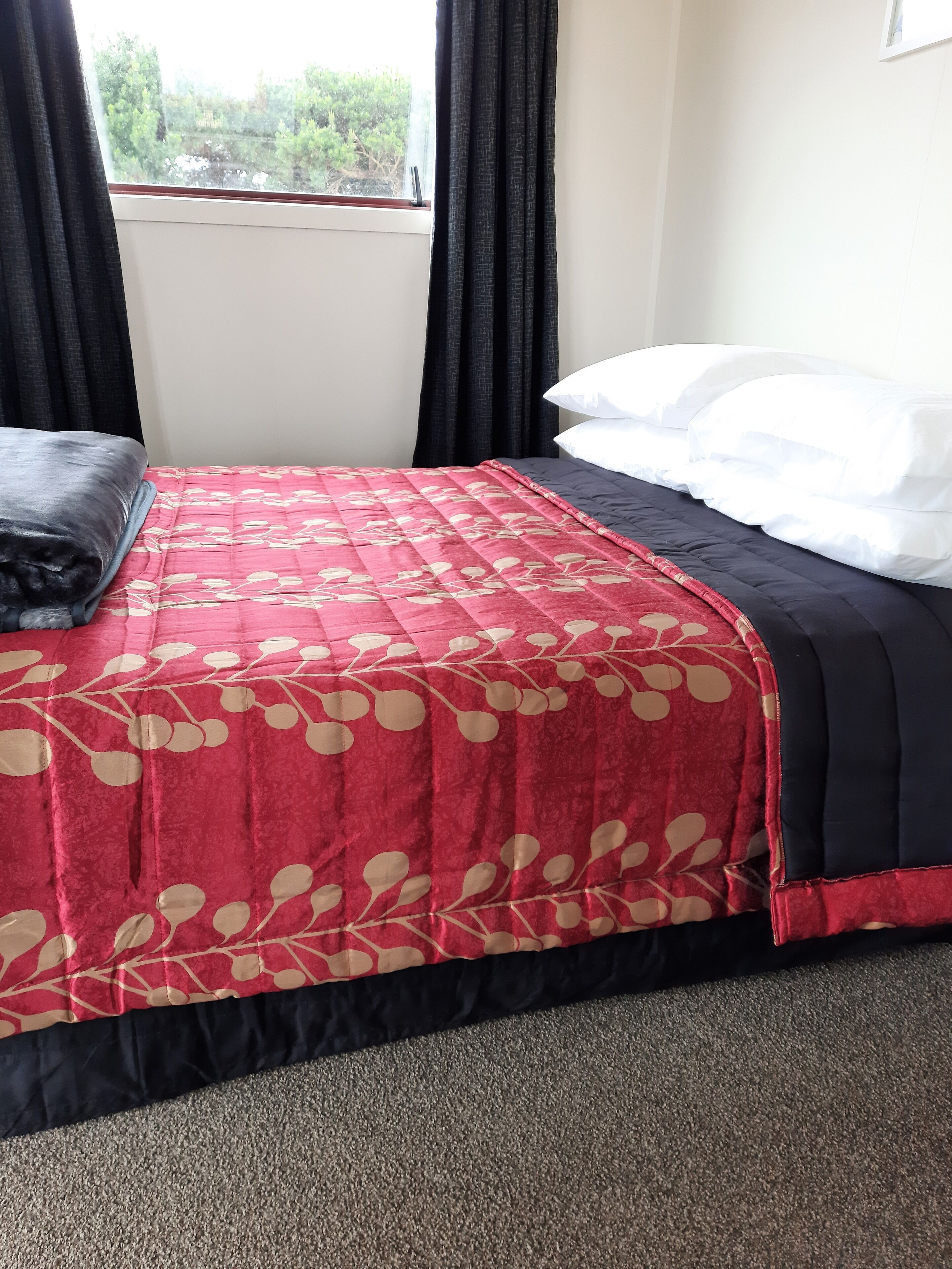 Premium bedding, blackout drapes, iron/ironing board, bed sheets
