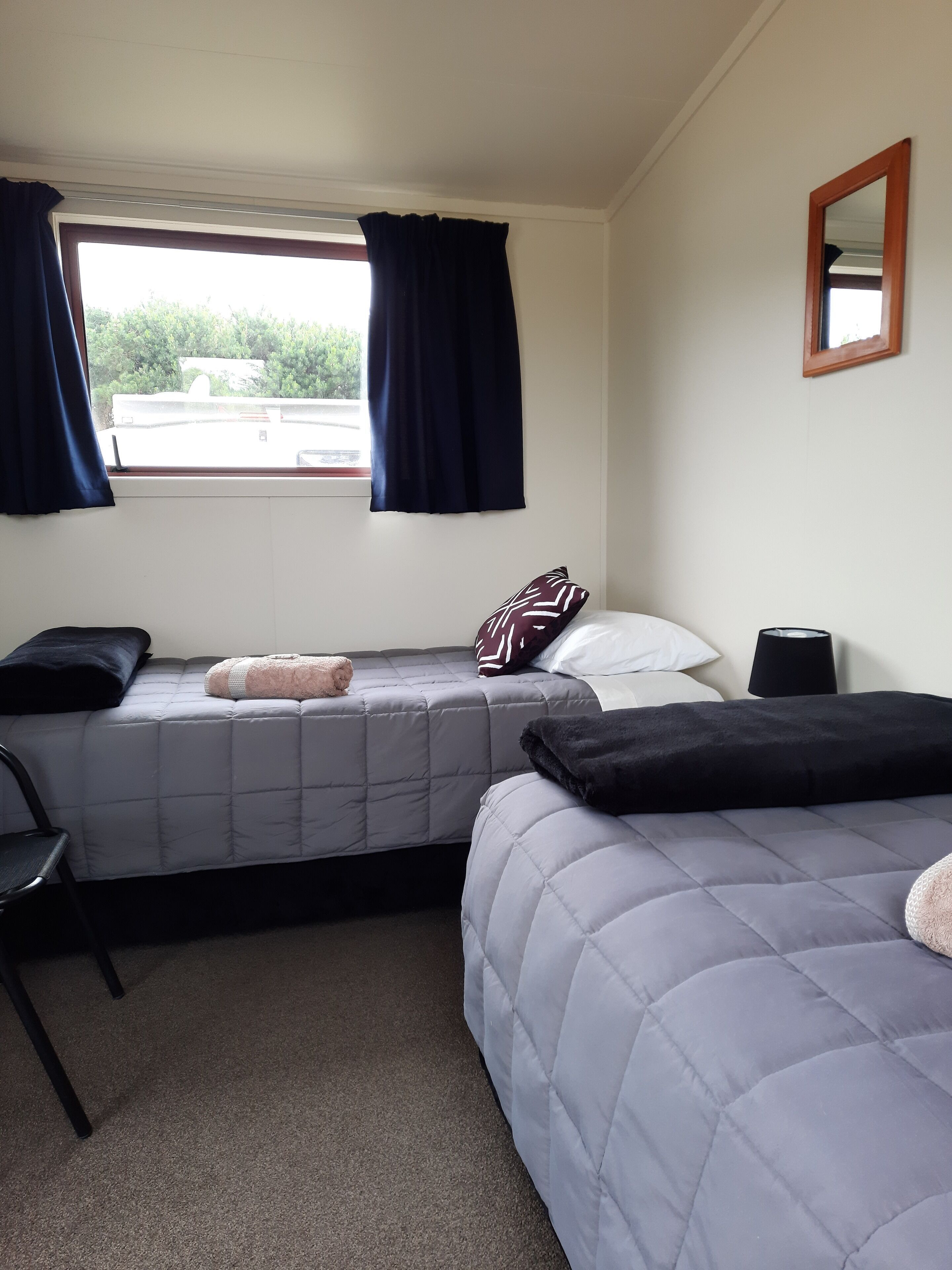 Premium bedding, blackout drapes, iron/ironing board, bed sheets