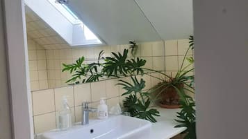 Shower, rainfall showerhead, hair dryer, towels