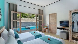 A hotel room with two beds, a TV, a small table with a vase, and a view of an outdoor pool. - Akasa Villa Tulamben (Tulamben)