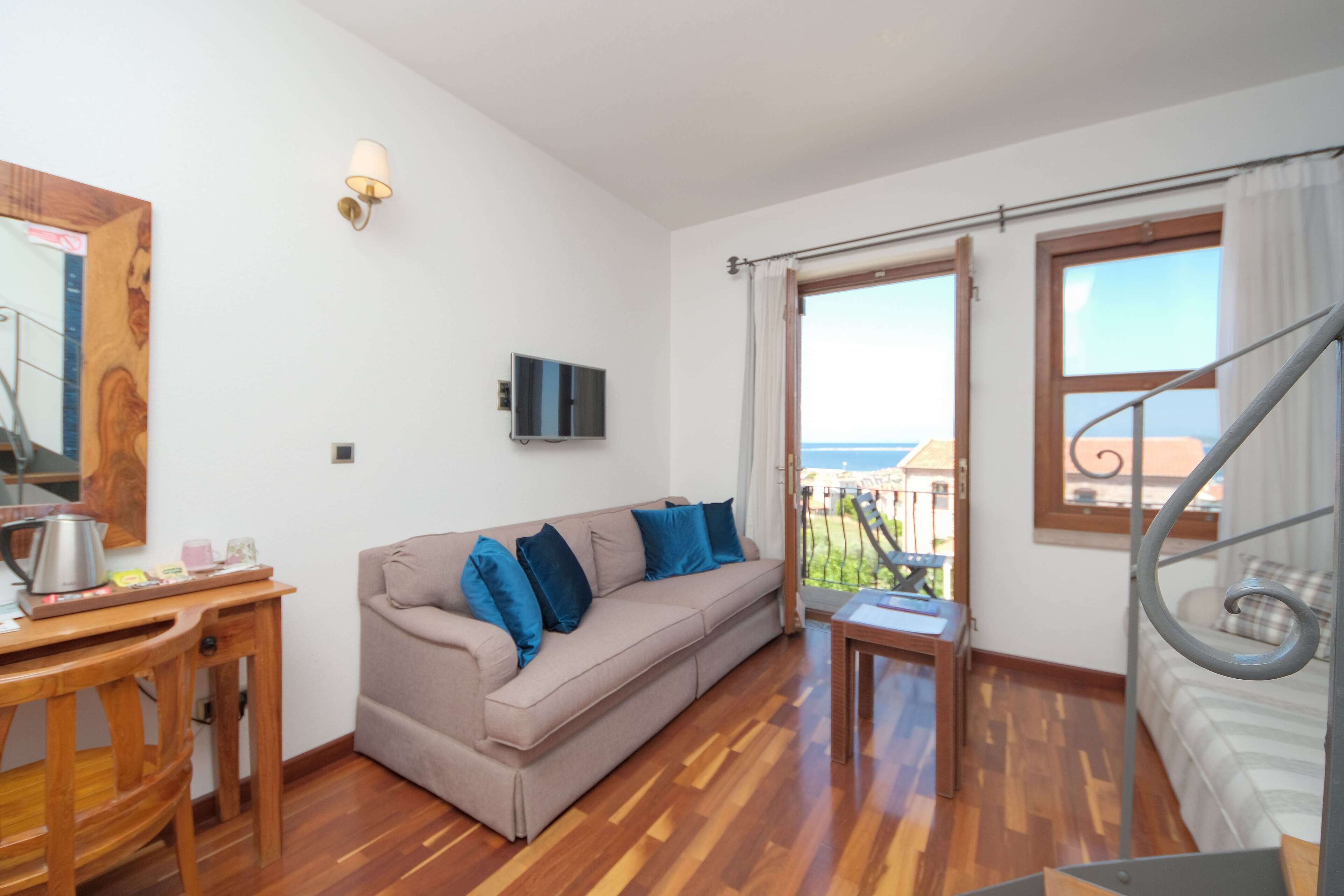 deluxe duplex, jetted tub, sea facing | living area | lcd tv