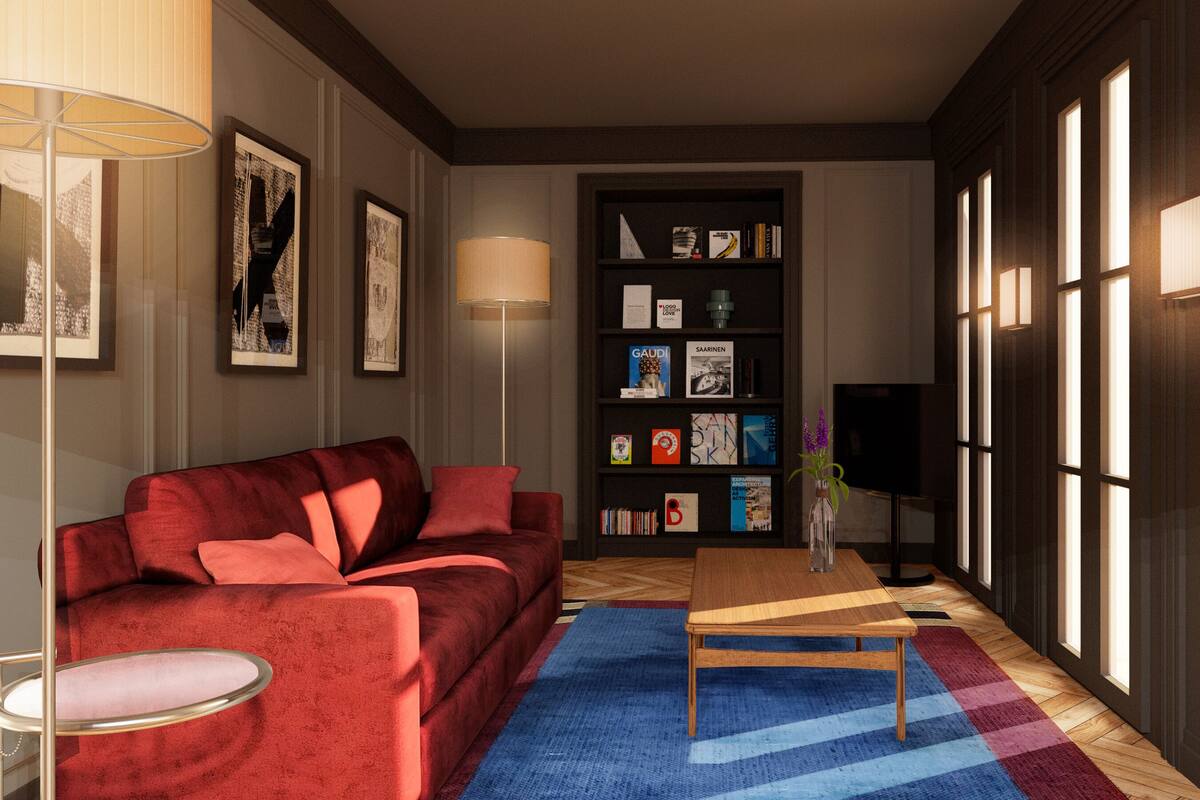 A living room with a red sofa, a coffee table, a bookshelf, and a TV.