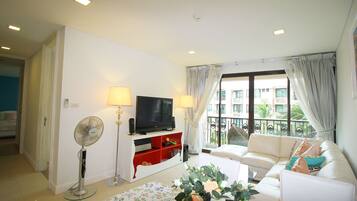 2 Bedrooms with pool view | Living area | Flat-screen TV