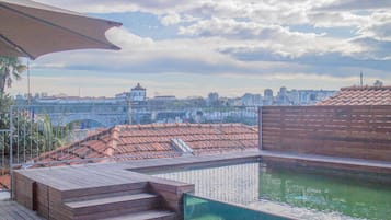 Outdoor pool, open 9:30 AM to 6:30 PM, pool umbrellas, pool loungers