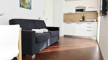 Monolocale comfort, balcone, piano elevato | Soggiorno