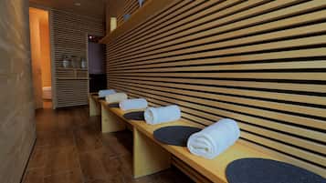Relax in a serene spa area with plush benches and tidy amenities.