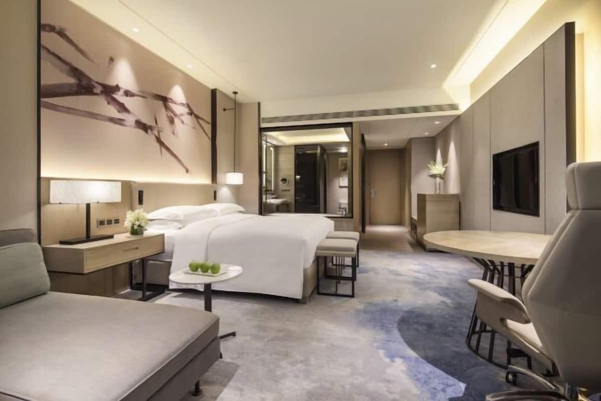 Premium bedding, down comforters, memory foam beds, minibar