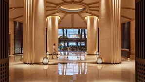 A spacious lobby with high ceilings, large columns, and a central skylight. - Grand Hyatt Sanya Haitang Bay Resort and Spa (Sanya)