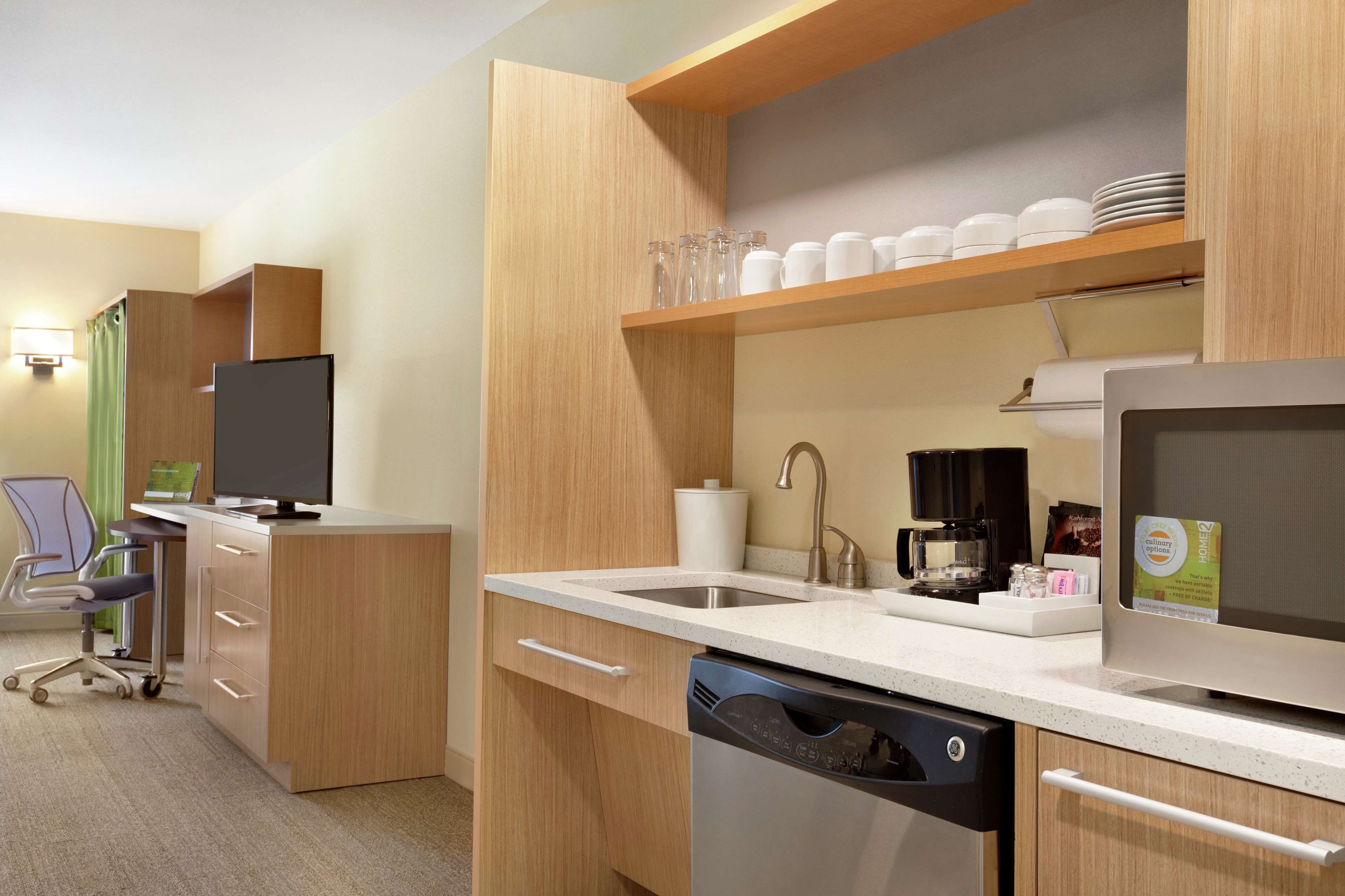 full-sized fridge, microwave, dishwasher, coffee/tea maker