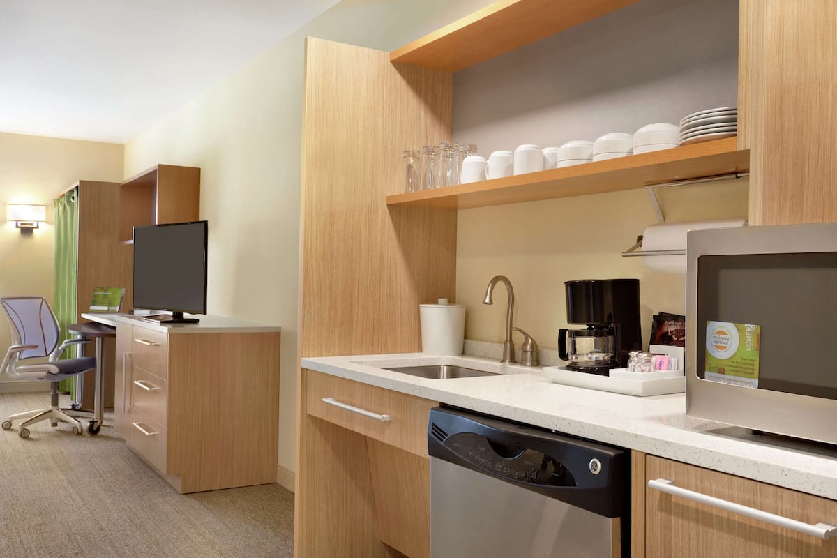 full-sized fridge, microwave, dishwasher, coffee/tea maker