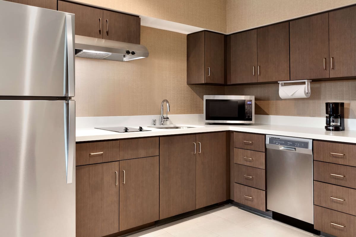 full-sized fridge, microwave, dishwasher, coffee/tea maker