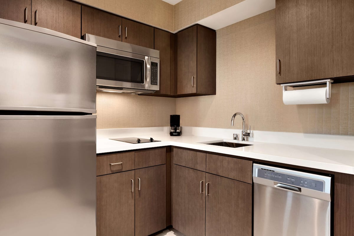full-sized fridge, microwave, dishwasher, coffee/tea maker