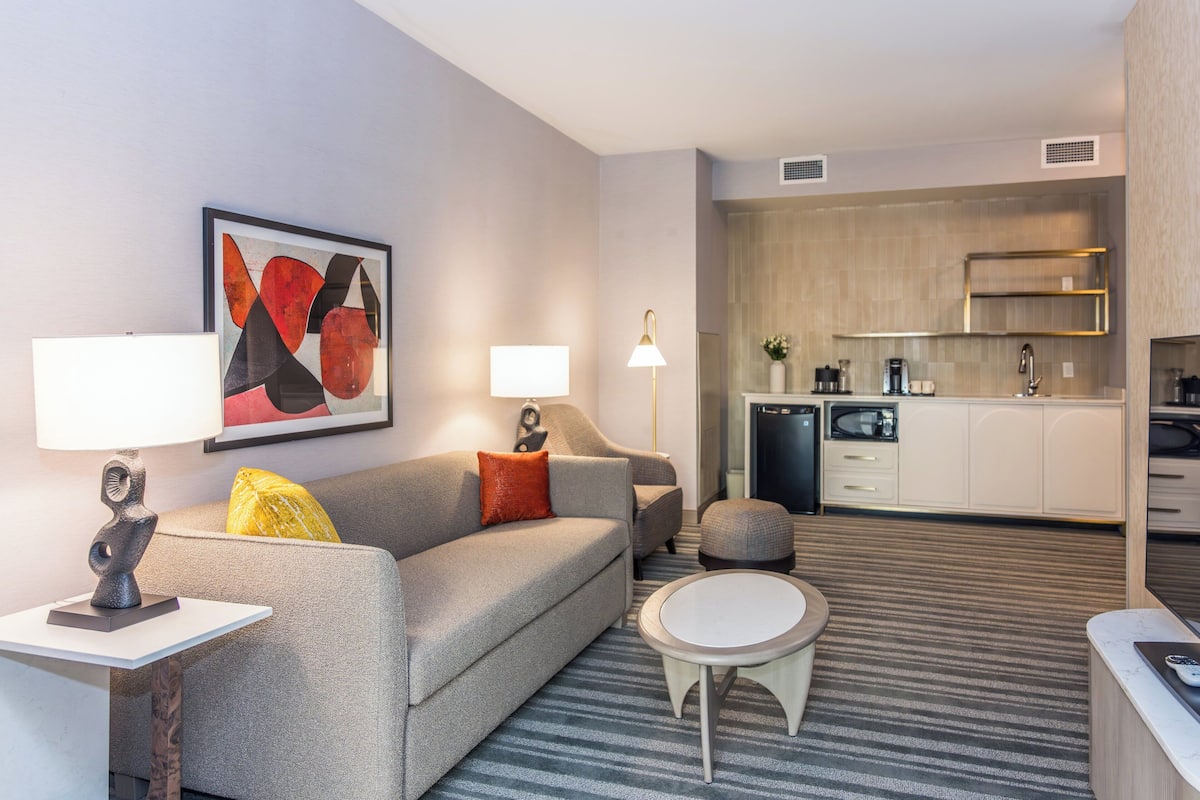 Suite, 1 King Bed (Additional Living Area) | In-room safe, desk, laptop workspace, iron/ironing board