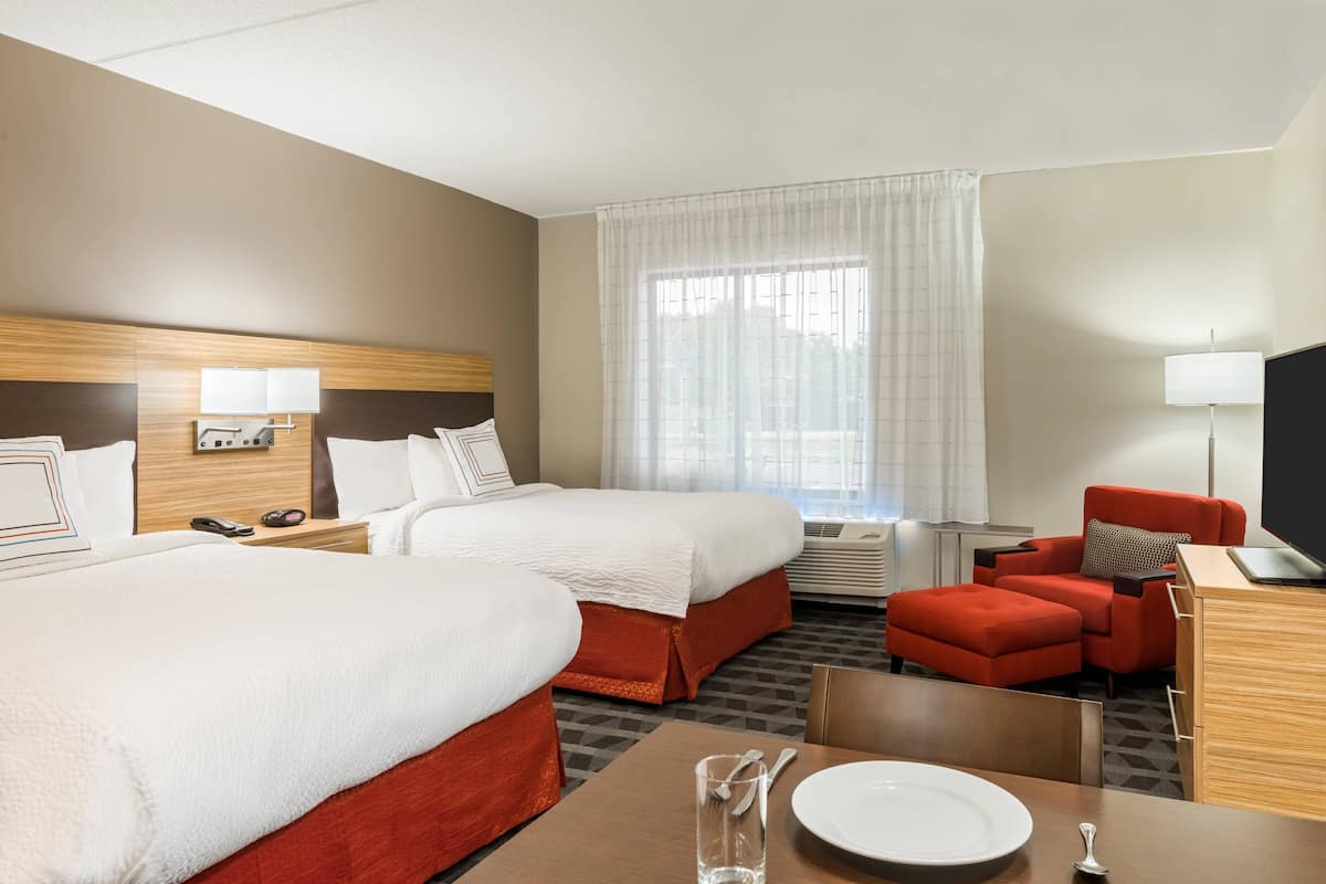 Premium bedding, desk, laptop workspace, blackout curtains