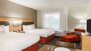 Premium bedding, desk, laptop workspace, blackout drapes