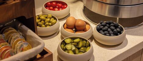 A kitchen counter with bowls of various food items.