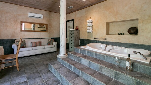 Suite, 1 King Bed (El Jefe's Casa) | Bathroom | Combined shower/bathtub, jetted bath, free toiletries, towels - Austin Street Retreat - El Jefe's (Fredericksburg)