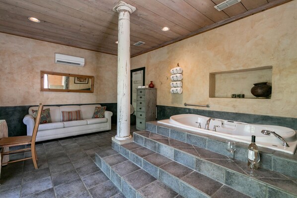 Suite, 1 King Bed (El Jefe's Casa) | Bathroom | Combined shower/bathtub, jetted bath, free toiletries, towels - Austin Street Retreat - El Jefe's (Fredericksburg)