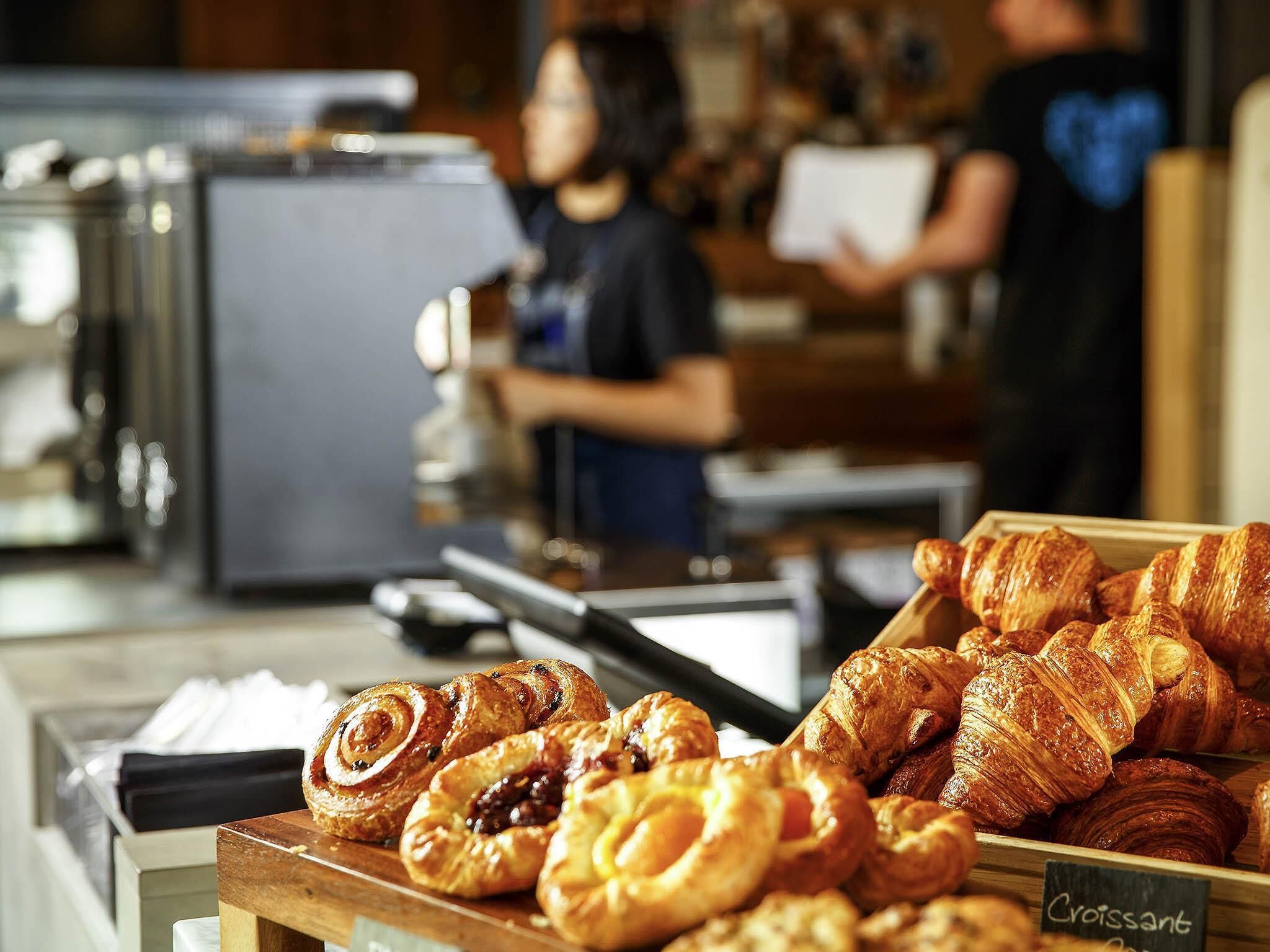 A bakery display with various pastries.