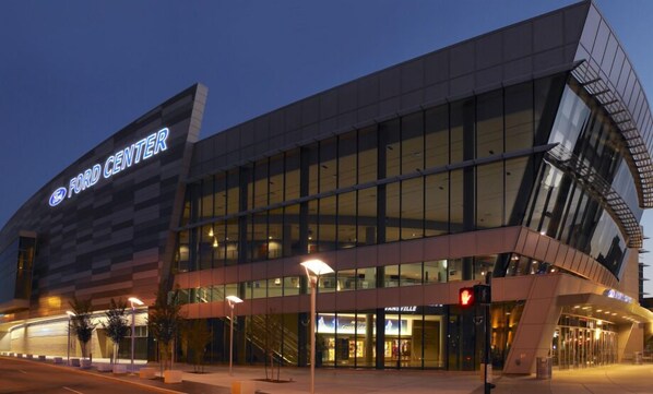 A modern building with a large glass facade and a sign reading "Ford Center". - DoubleTree by Hilton Evansville (Evansville)