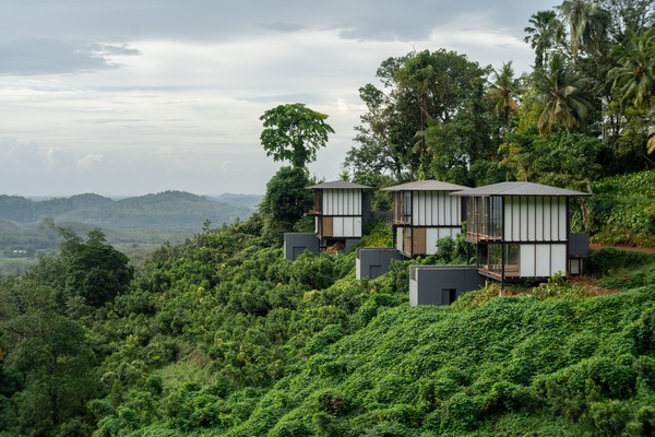 Experience serene views from this elevated retreat, surrounded by lush greenery and rolling hills.