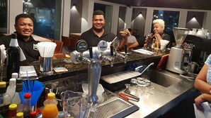A bar area with multiple beer taps, a coffee machine, and various bar tools. - Peninsula International Hotel (Suva)