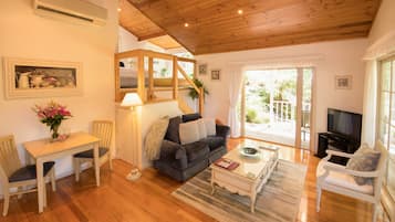 Luxury Cottage, 1 Bedroom | Living room | Flat-screen TV, fireplace, DVD player