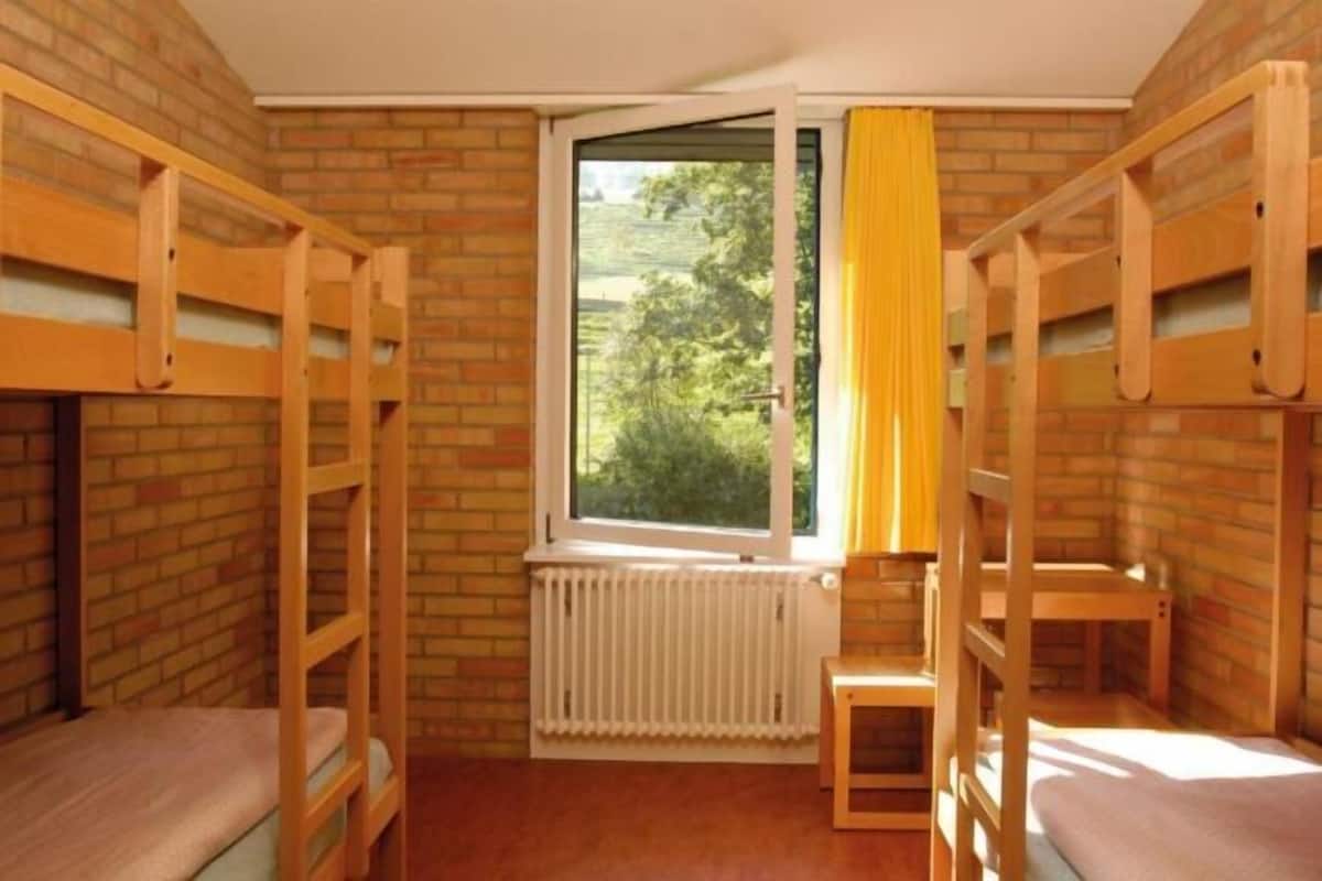 Desk, iron/ironing board, bed sheets