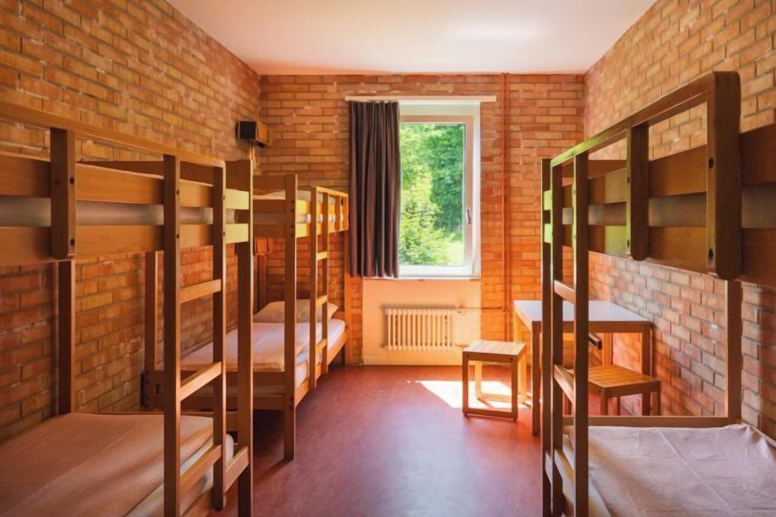 Desk, iron/ironing board, bed sheets