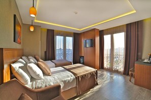Luxe beddengoed, een minibar, een kluis op de kamer, een bureau