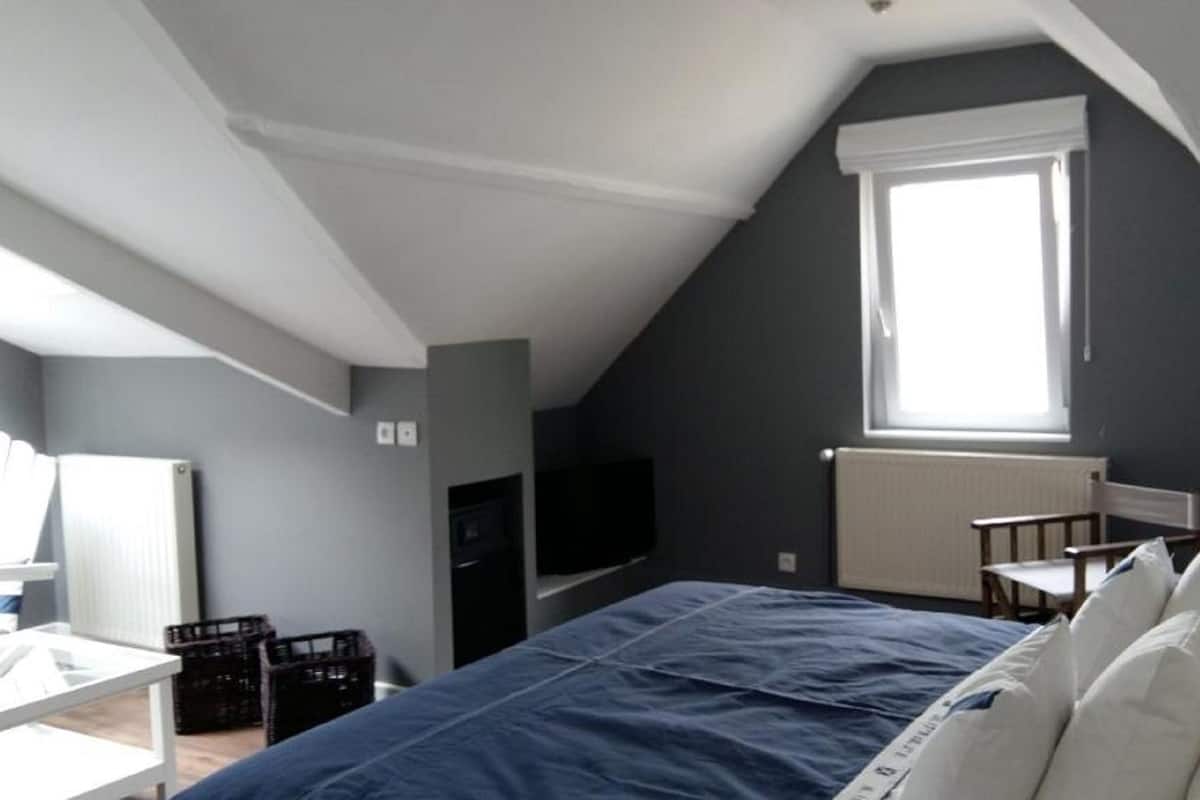 Suite | Een minibar, een kluis op de kamer, verduisterende gordijnen