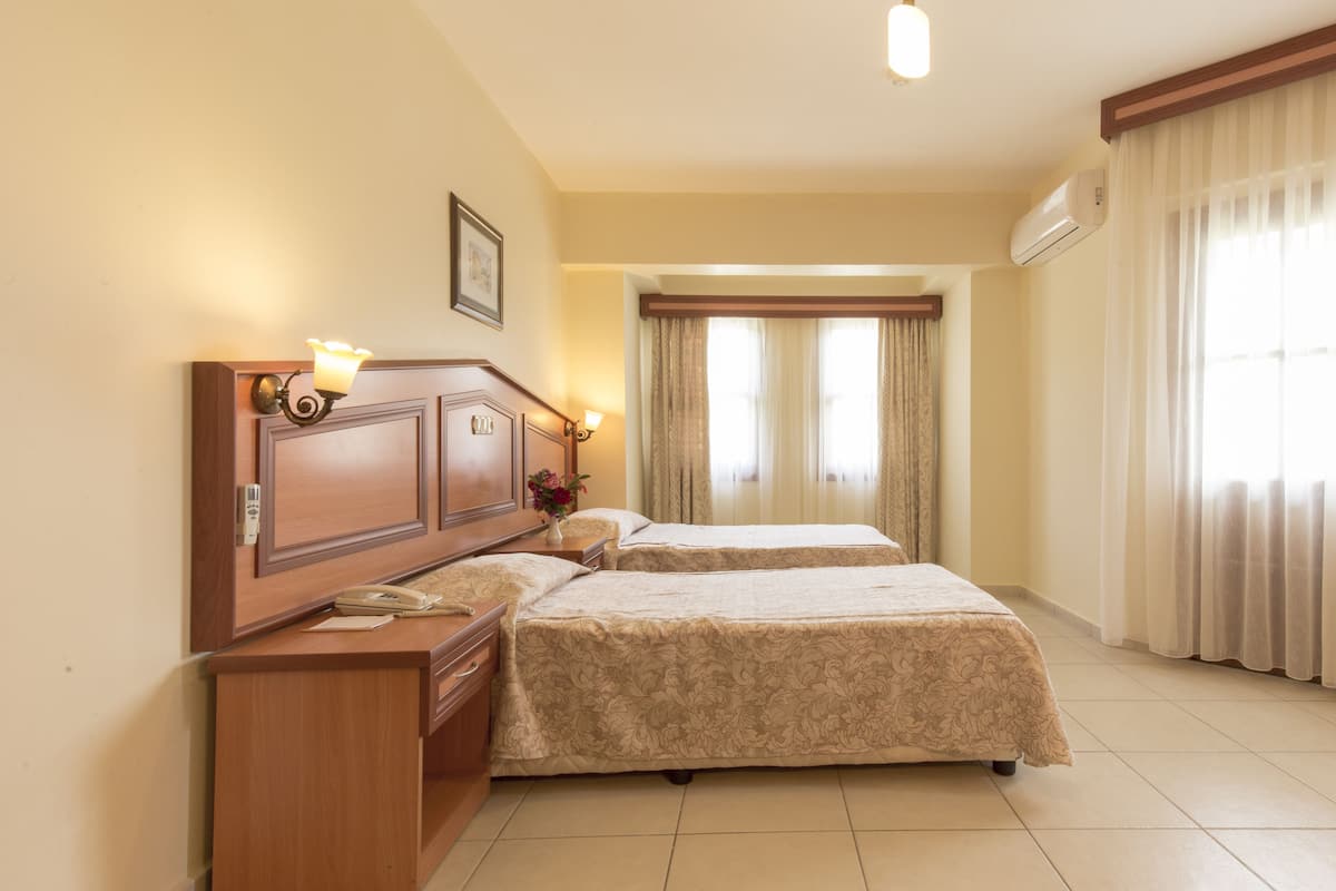 Family Room, 2 Bedrooms | Free minibar, in-room safe, desk, free cots/infant beds