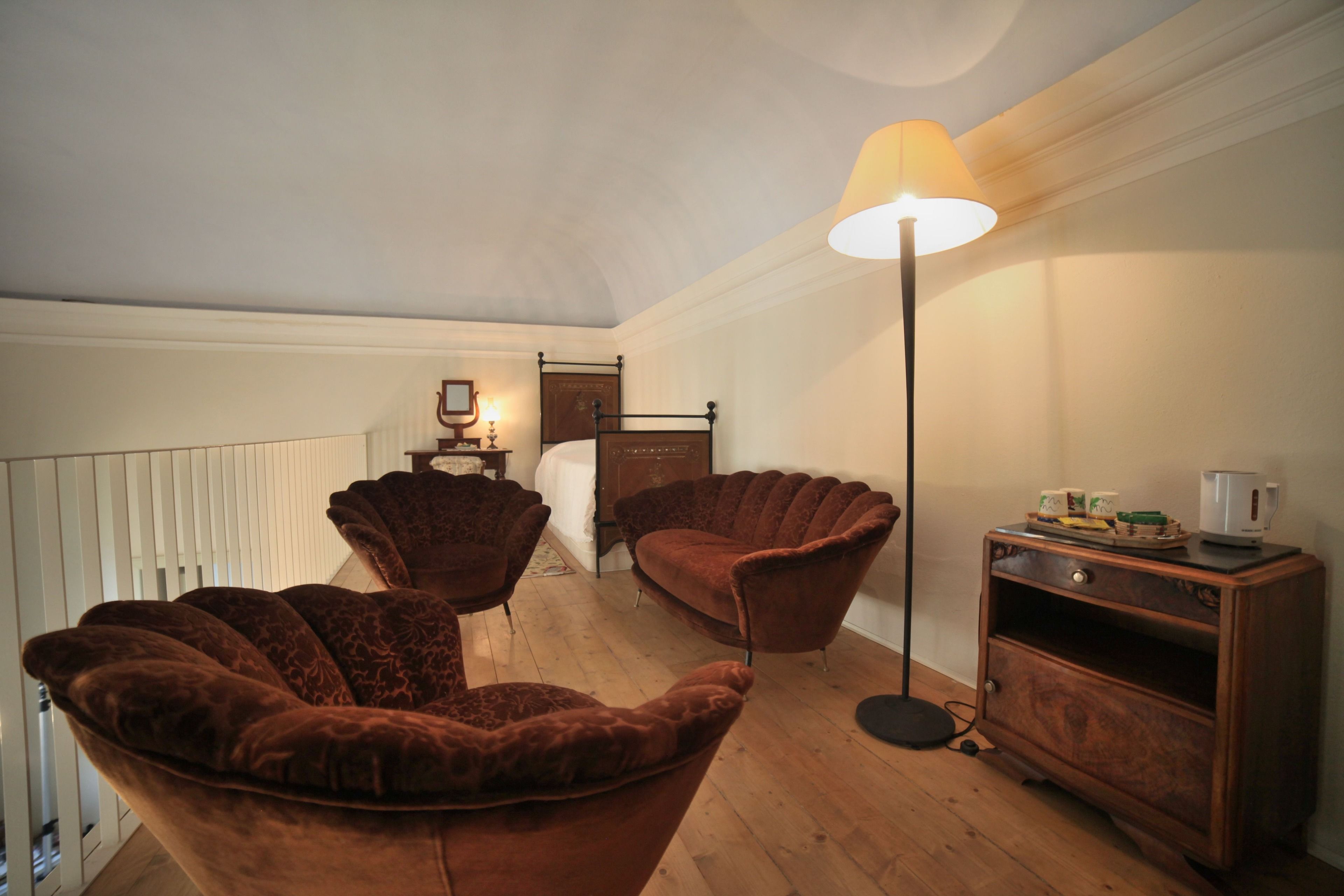 superior triple room (la dimora) | living area | lcd tv, pay films