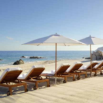 On the beach, sun loungers, beach umbrellas