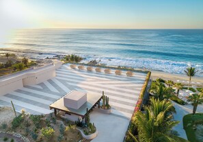 A resort with a pool area, a cactus garden, and a view of the ocean. - Grand Velas Los Cabos - All Inclusive (Cabo San Lucas)