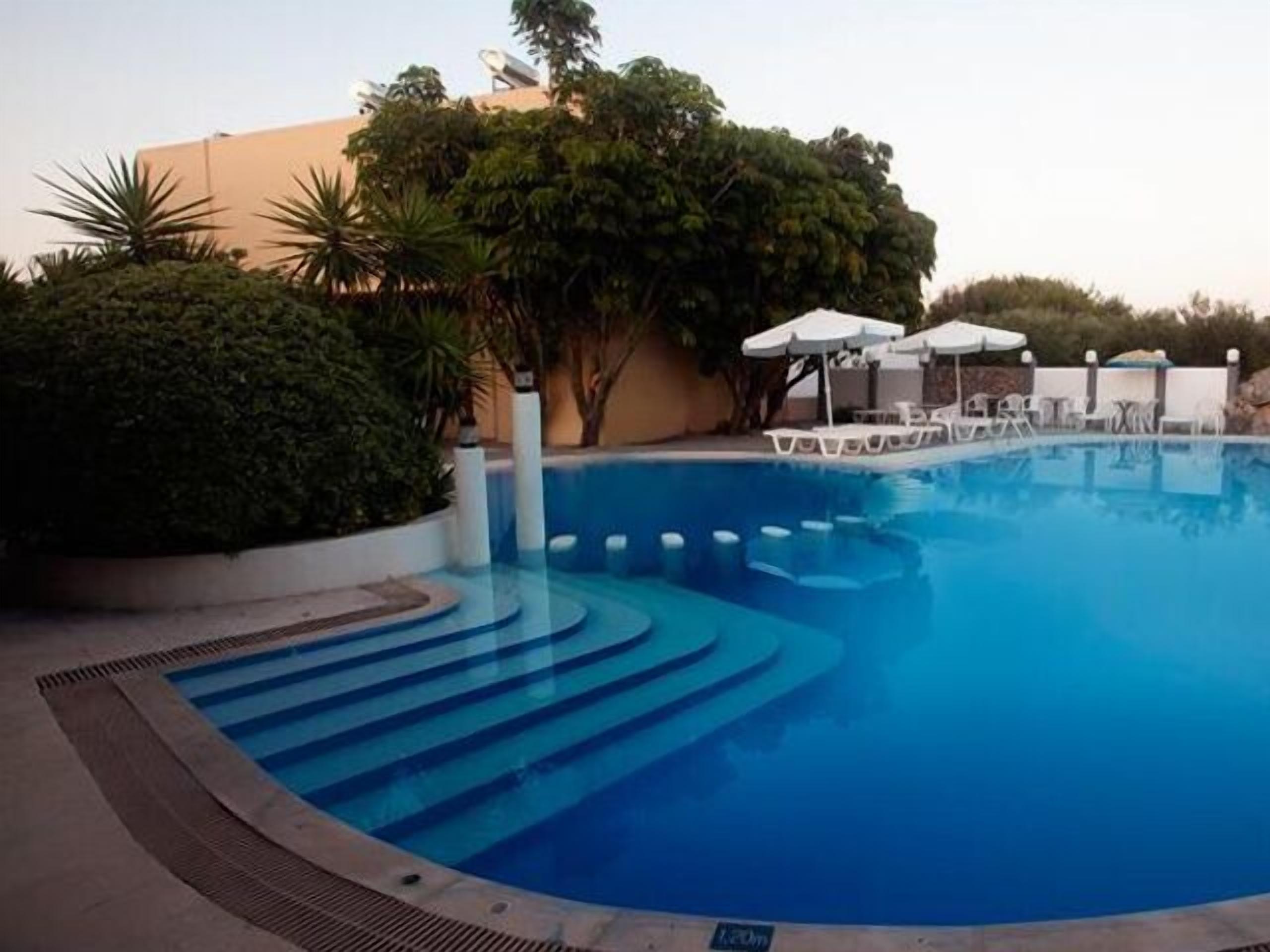 Seasonal outdoor pool, pool umbrellas, pool loungers