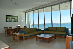Superior Penthouse, 4 Bedrooms, Ocean View | Living area | Plasma TV