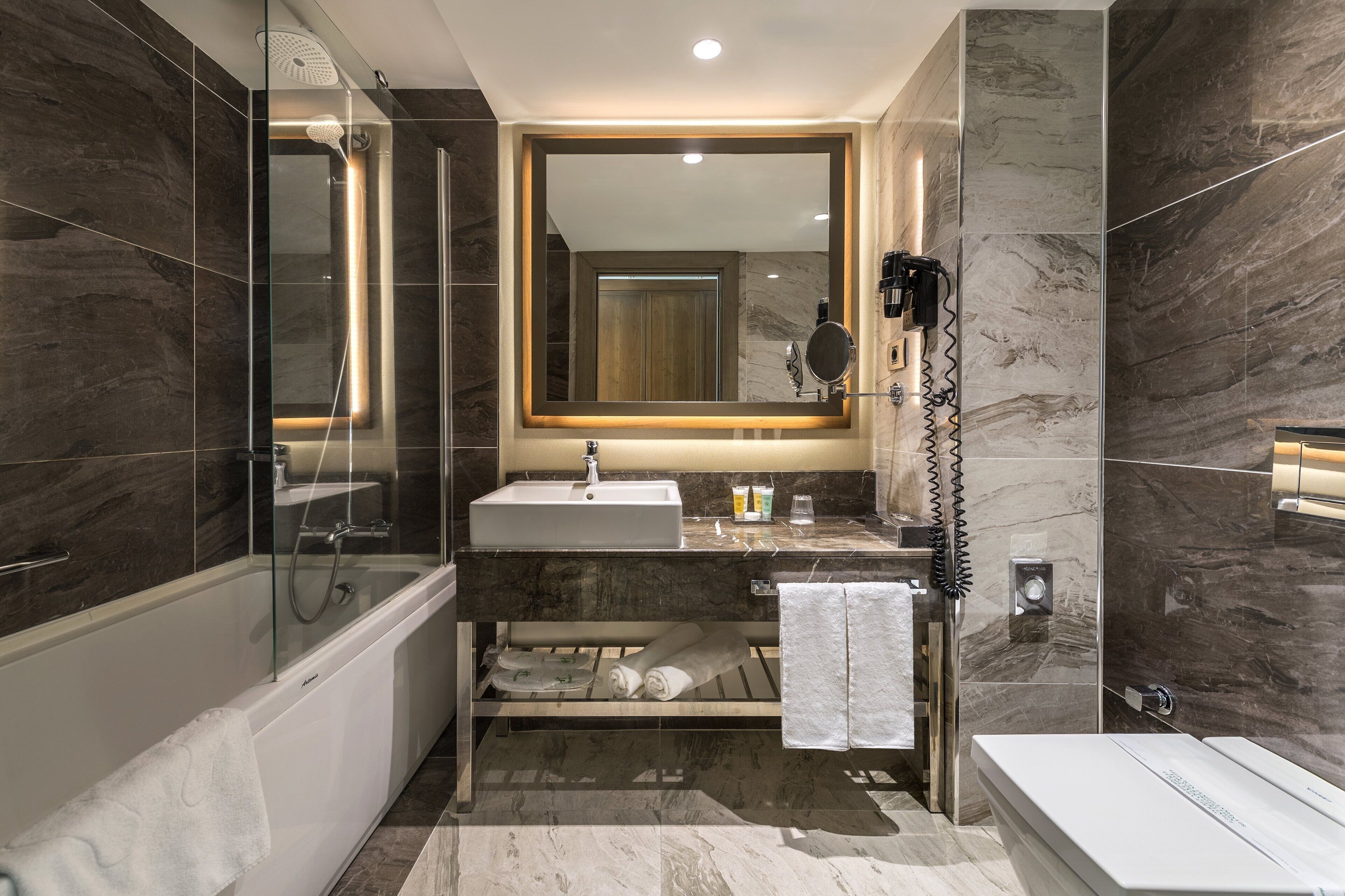 hair dryer, bathrobes, slippers, towels