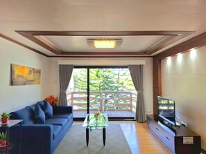 Appartement Deluxe | Aire de séjour | Téléviseur à écran plat, lecteur de DVD