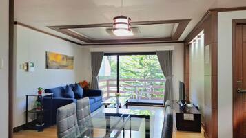 Deluxe Apartment | Living area | Flat-screen TV, DVD player