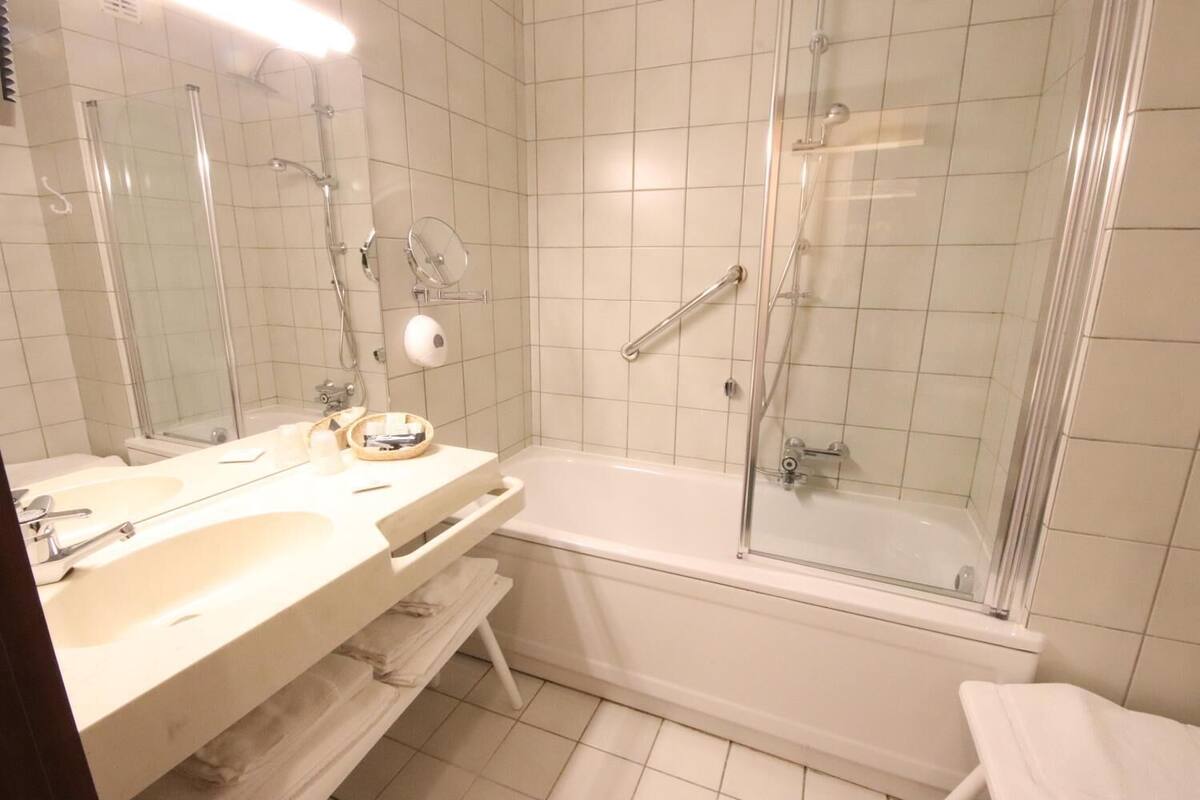 bathtub, free toiletries, hair dryer, bathrobes