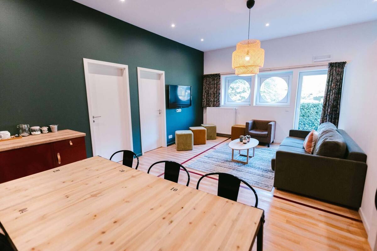 family loft, 2 bedrooms, river view | living area | tv, ping pong, offices