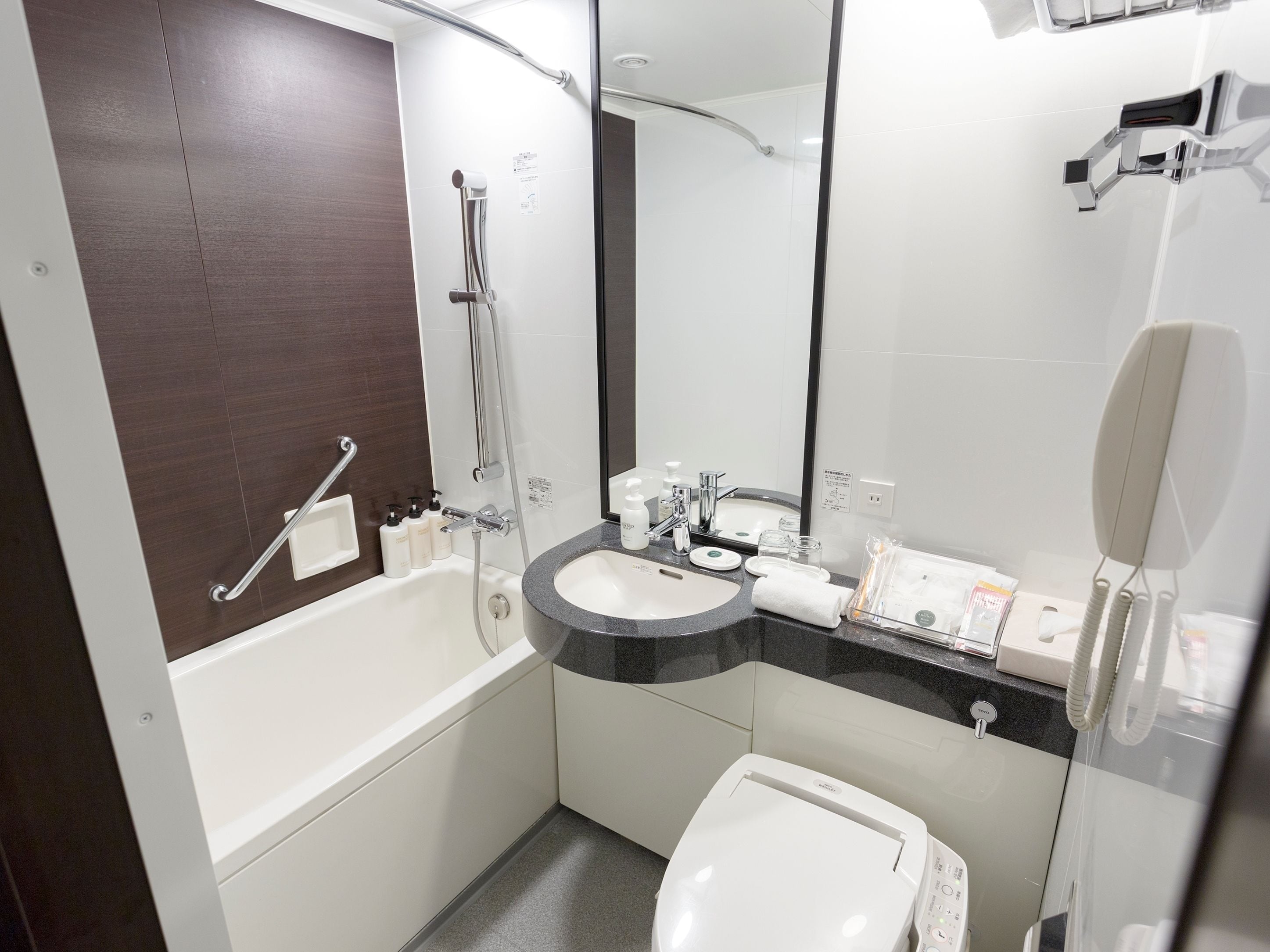 combined shower/bathtub, free toiletries, hair dryer, slippers